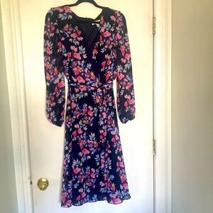 Beautiful floral dress with long see through sleeves.